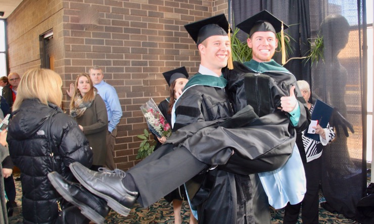 two men at graduation