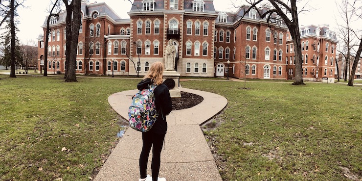 sara in front of ambrose hall