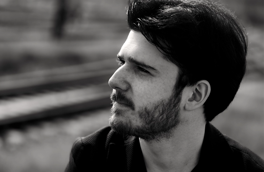 A headshot of Dmitri Malignan the French pianist.