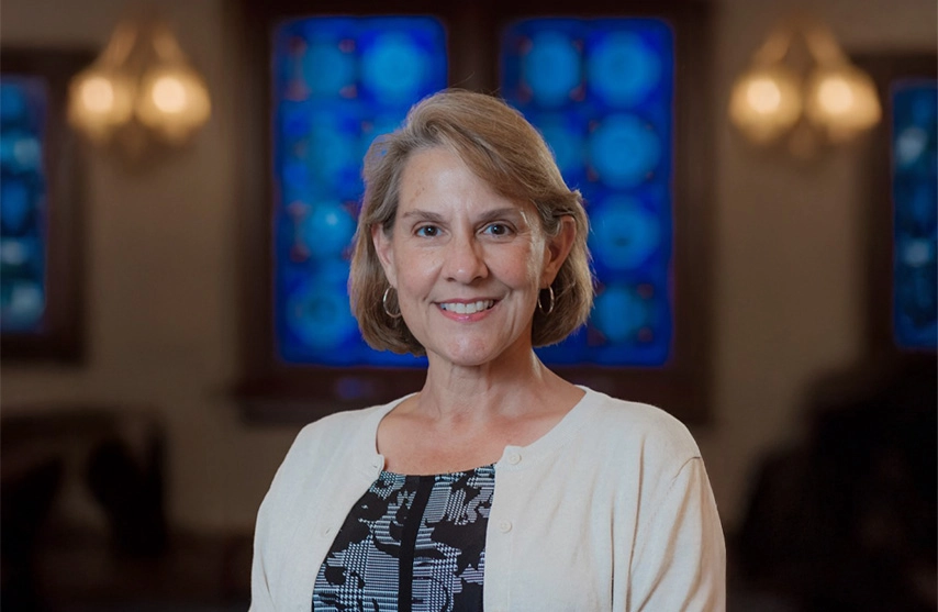 Lorri Glover, PhD, smiles at the camera.