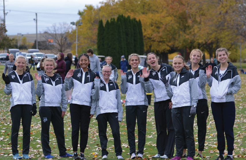 Female cross country team cheering
