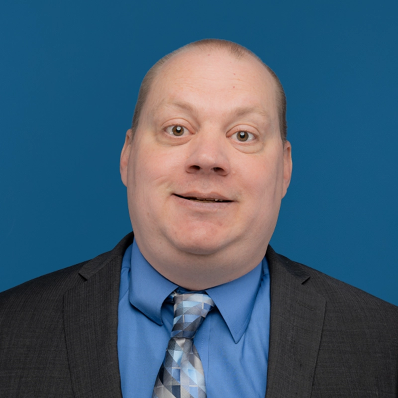 Travis Eygabroad smiles at the camera.