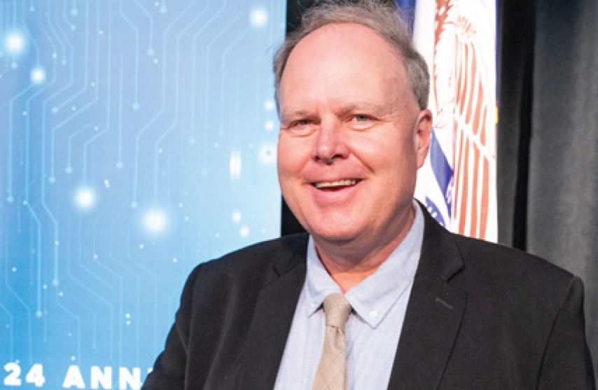 Dave Baker smiles for a photo.