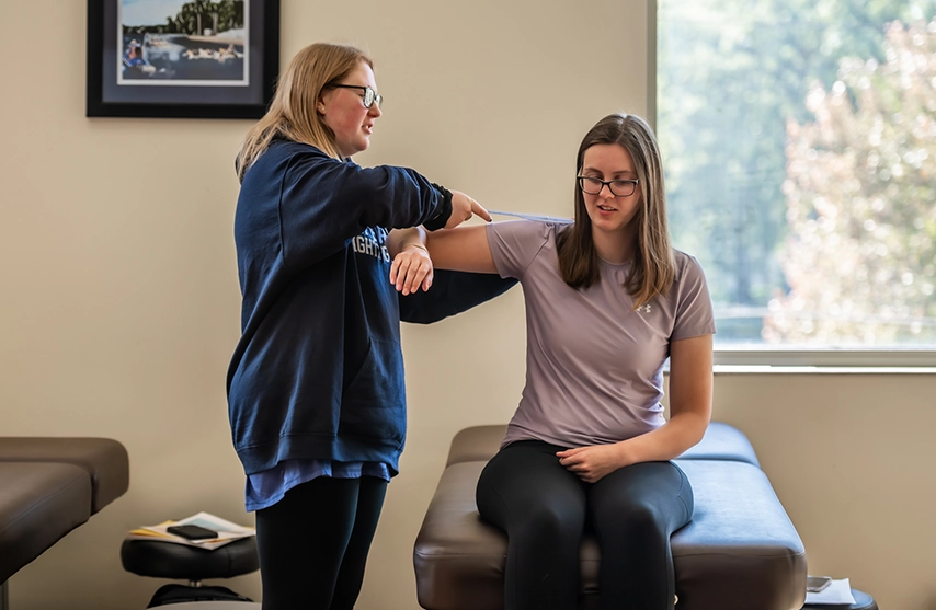 Students practice kinesiology techniques.