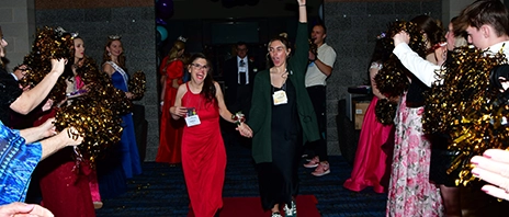 Students walk into the St. Ambrose University Rogalski Ballroom during the annual Night to Shine event.