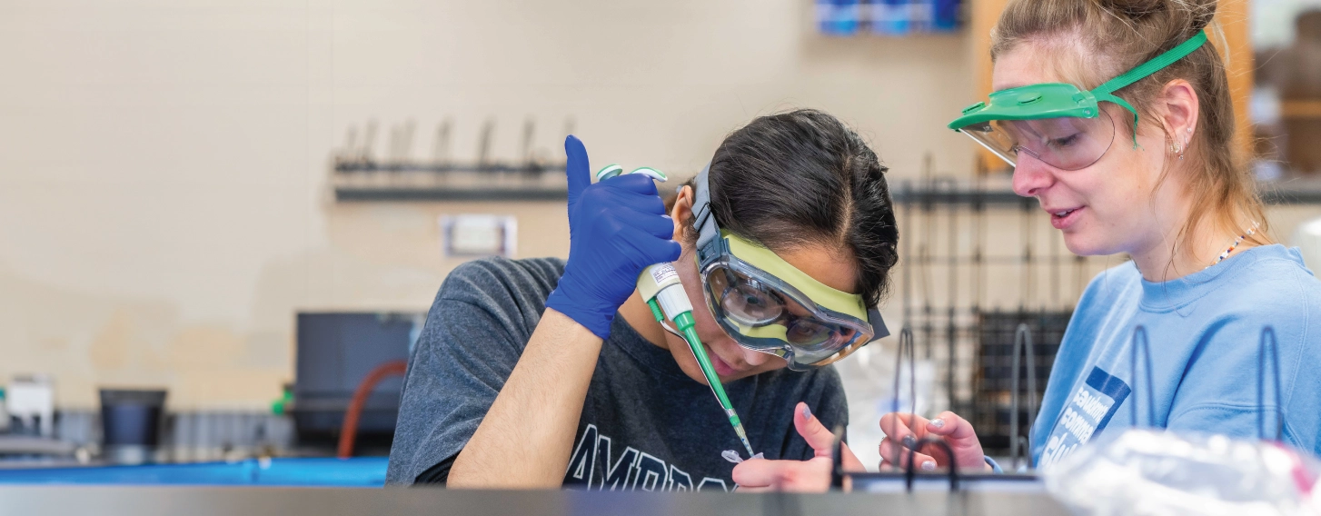 Biochemistry students working in lab during class.