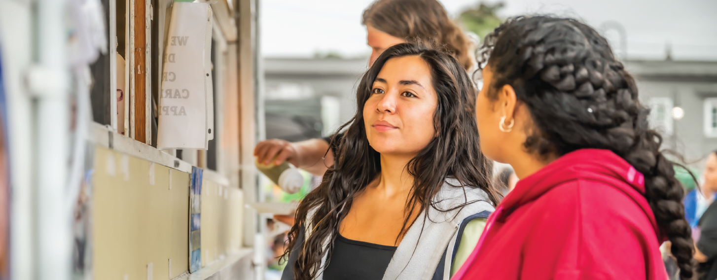 Student ordering from a food truck in Davenport.
