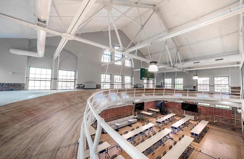 An indoor running track is suspended over a newly remodeled classroom.
