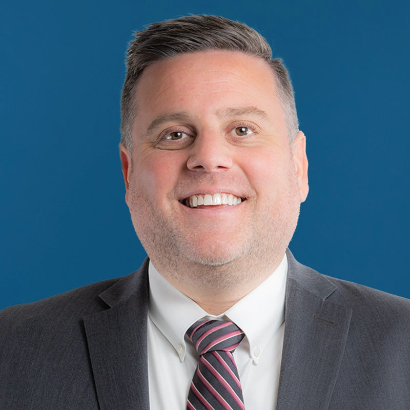 Matthew Blair smiles at the camera.